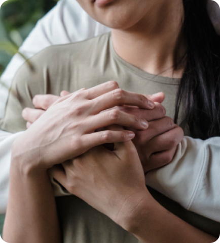 couple holding hands and hugging